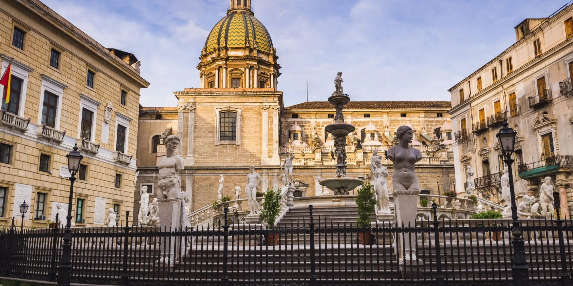 Pretoria Fountain in Piazza Pretoria with the dome of Church of San Giuseppe dei Teatini, Palermo, Sicily, Italy, Europe